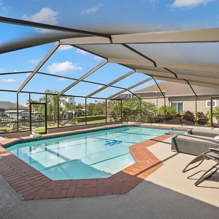 Surfside Beach House - Gorgeous Canal Front Home - Heated Pool & Boat Dock